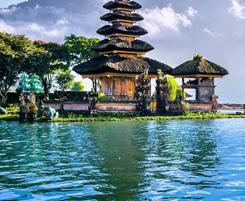 Balinese water temple with a tiered pagoda on a lake
